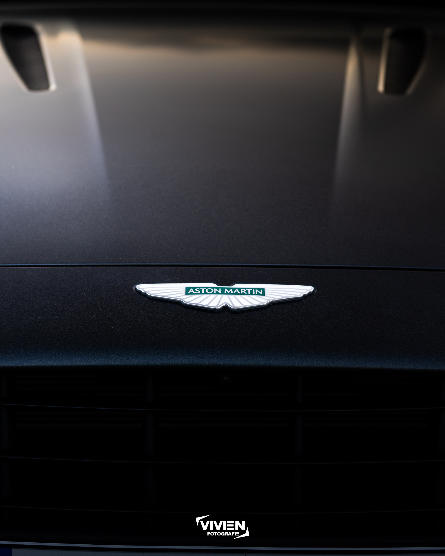Aston Martin · Satin Black · Wing Badge